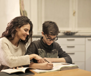 Tutor helping students with studies